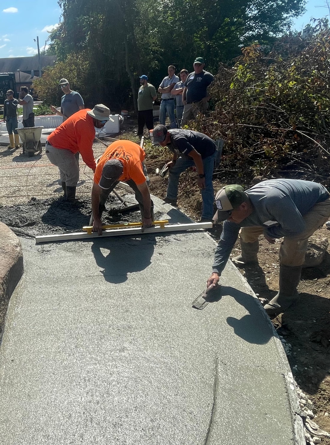 Concrete Crew at Work — Our team pouring and finishing a large concrete surface.